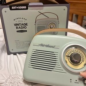 light blue and brown wireless radio/speaker . original box never used